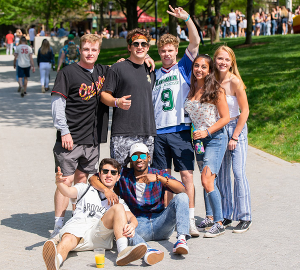 People pose for a photo outside in a group.