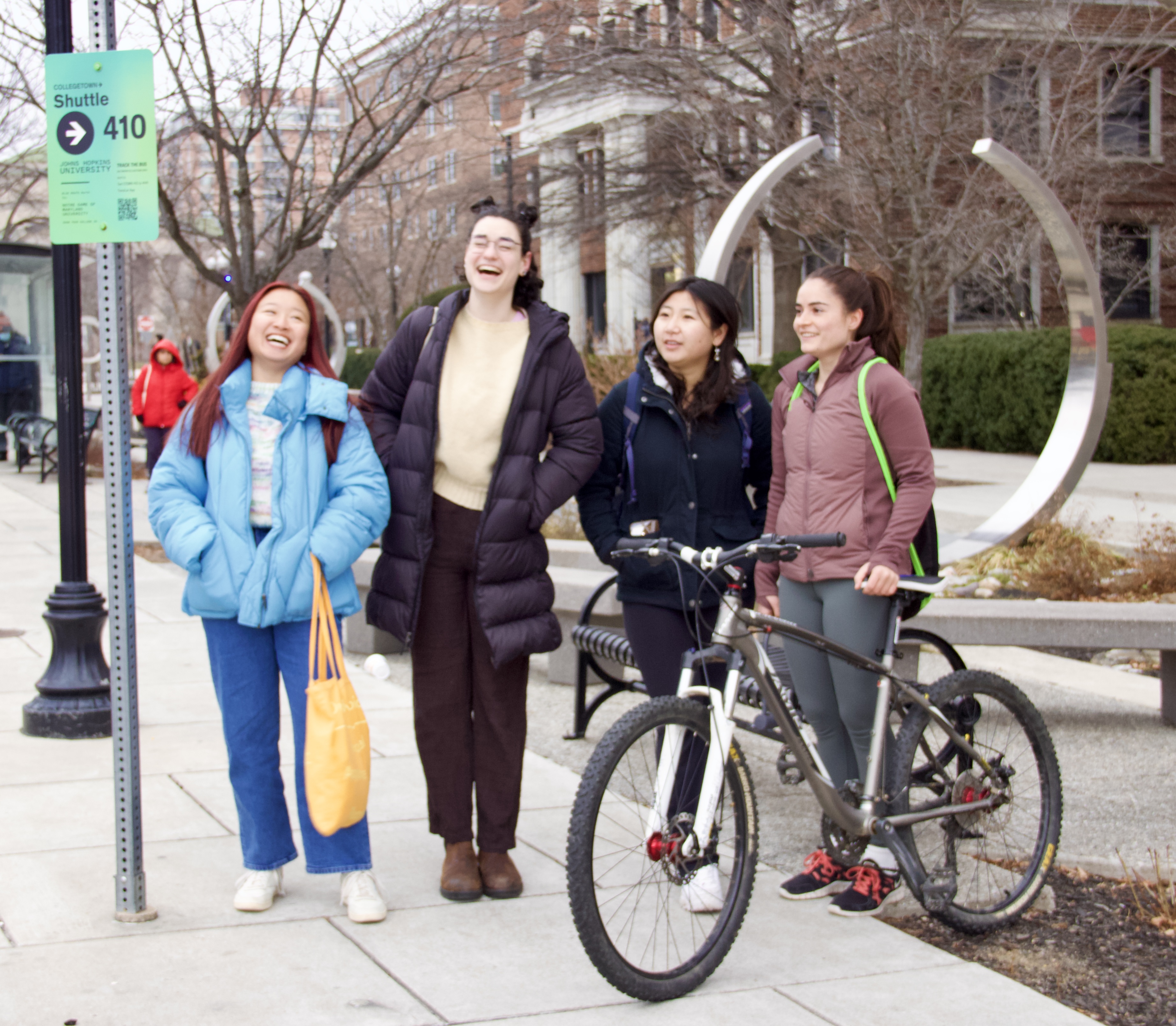 Group photo of students preparing to ride the Collegetown Shuttle