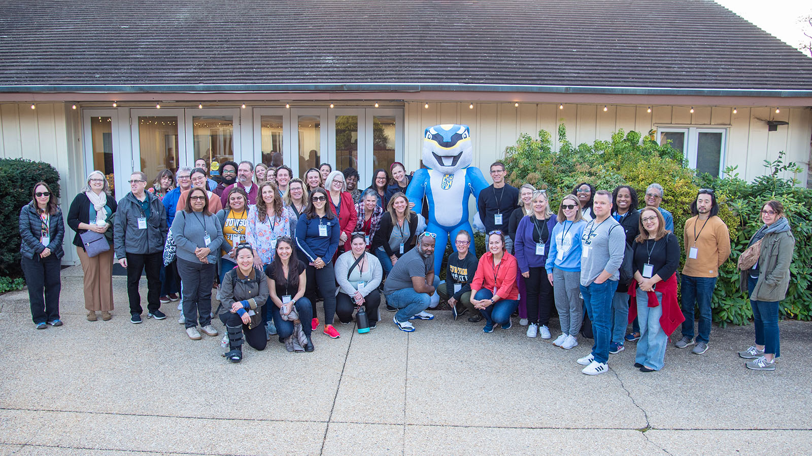 Collegetown and Gown Tour 2024 participants posing for a group photo at Goucher College