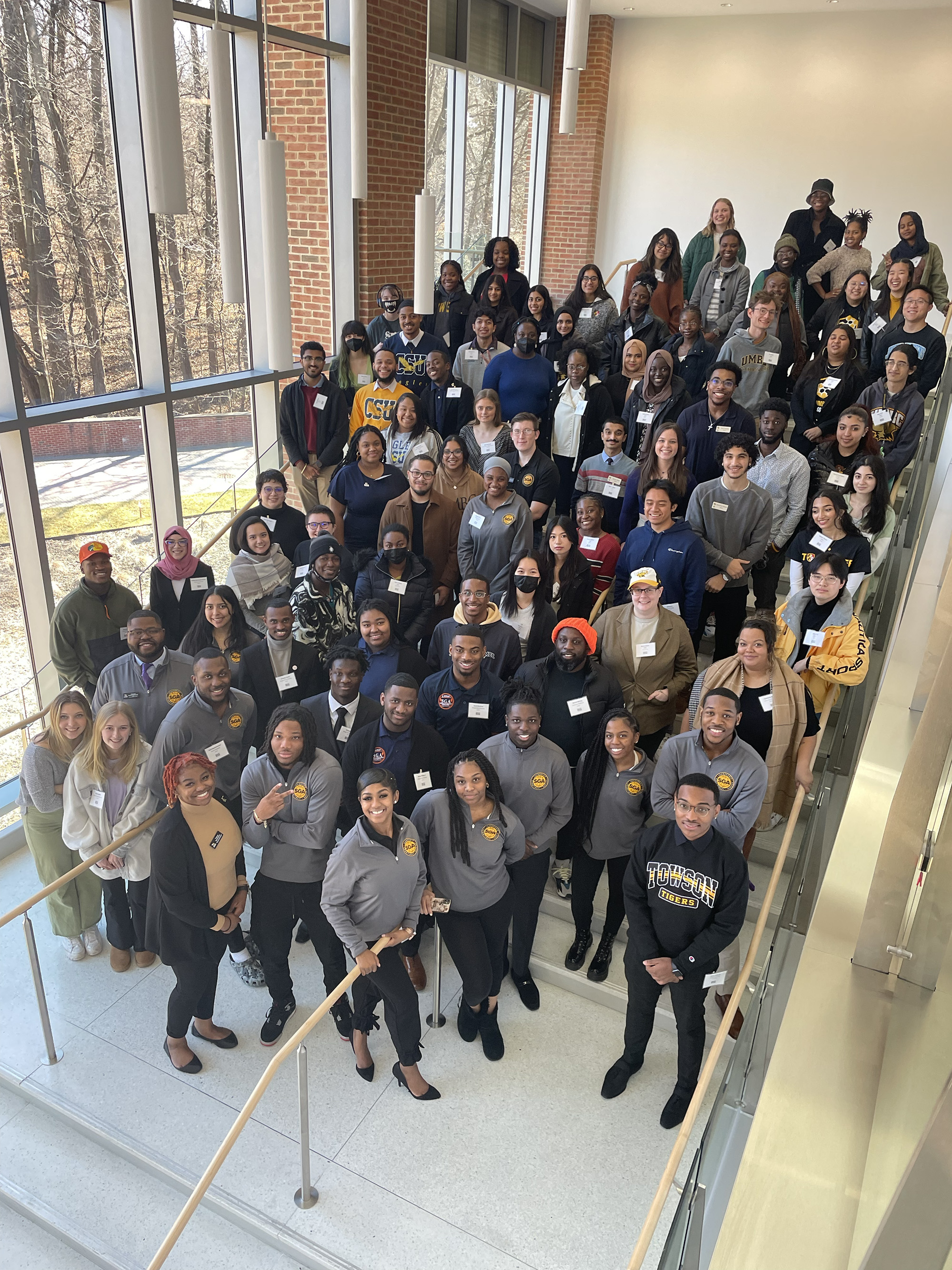 Group photo of 2023 SGA Summit participants posing on the stairs at Towson University