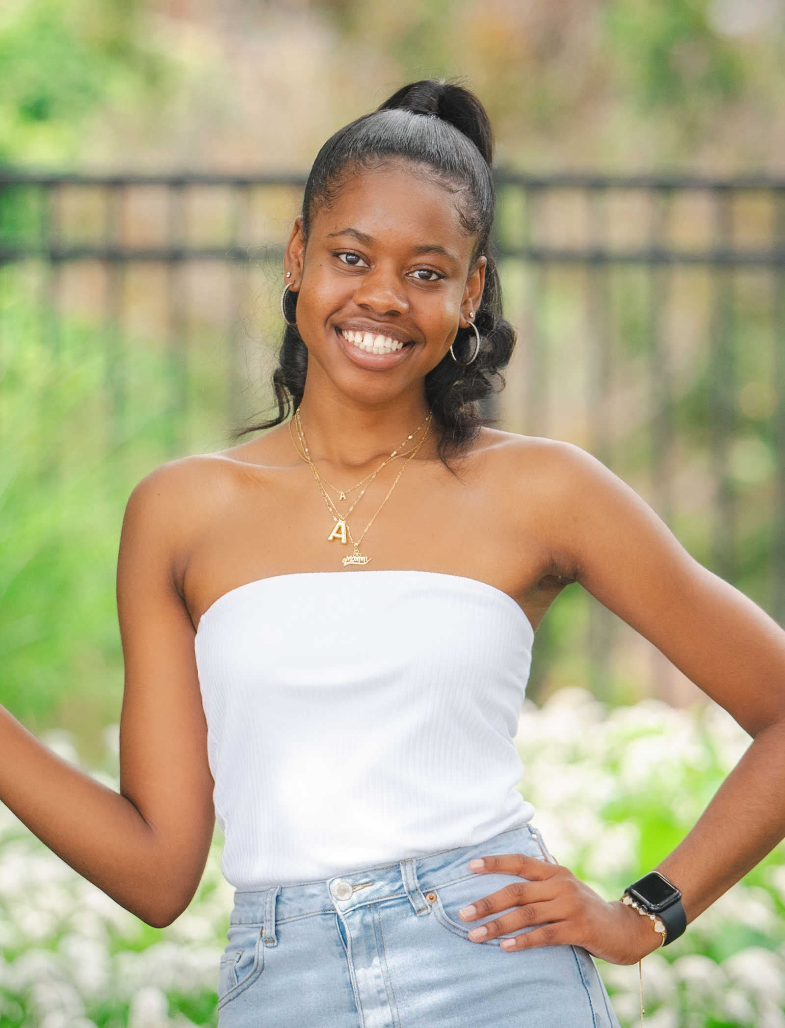 A student poses in a public park.